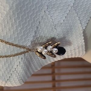 Goldtone chain necklace with faux pearls and navy blue with gold disc's pendant